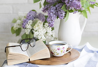 Cozy Reading Scene with Coffee, Book, and Lilac Flowers