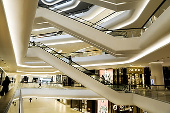 Modern Luxury Shopping Mall Interior With Escalators And Gucci Store