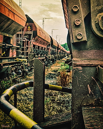 Rusty Freight Train Cars in Industrial Yard