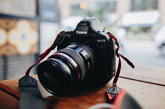 Canon EOS-1D X DSLR Camera on Wooden Table