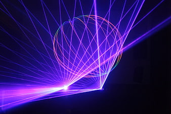 Vibrant Purple Laser Light Show with Geometric Patterns in Darkness