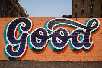 Colorful Good Graffiti on Orange Brick Wall