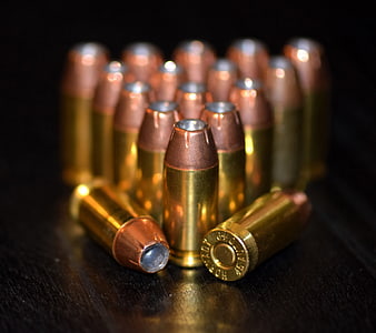Close-up of brass 45 ACP hollow point ammunition cartridges