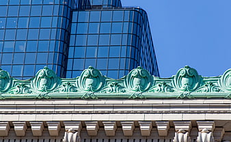 Ornate Green Copper Roof Detail Against Modern Glass Skyscraper