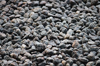 Close-up texture of gray gravel stones and pebbles