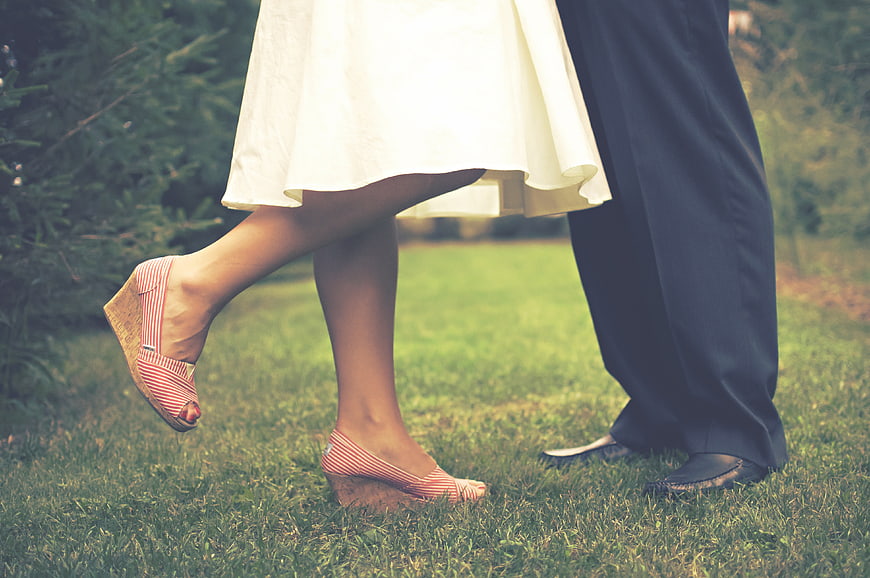 Bride and Groom Feet on Grass in Wedding Attire