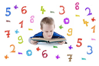 Young boy reading book surrounded by colorful floating math numbers