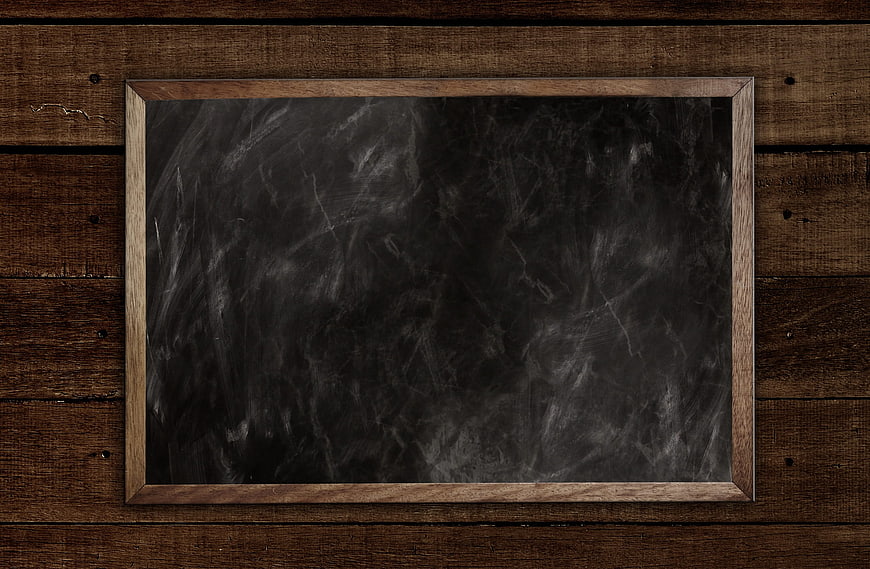 Empty Wooden Framed Blackboard on Rustic Dark Wood Wall Background