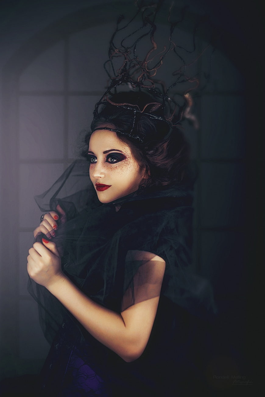 Gothic woman with dark makeup and crown portrait