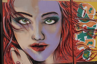 Vibrant Street Art Portrait of Woman with Green Eyes