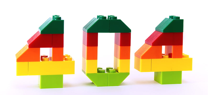 Colorful Lego Bricks Spelling 404 Error Code on White Background