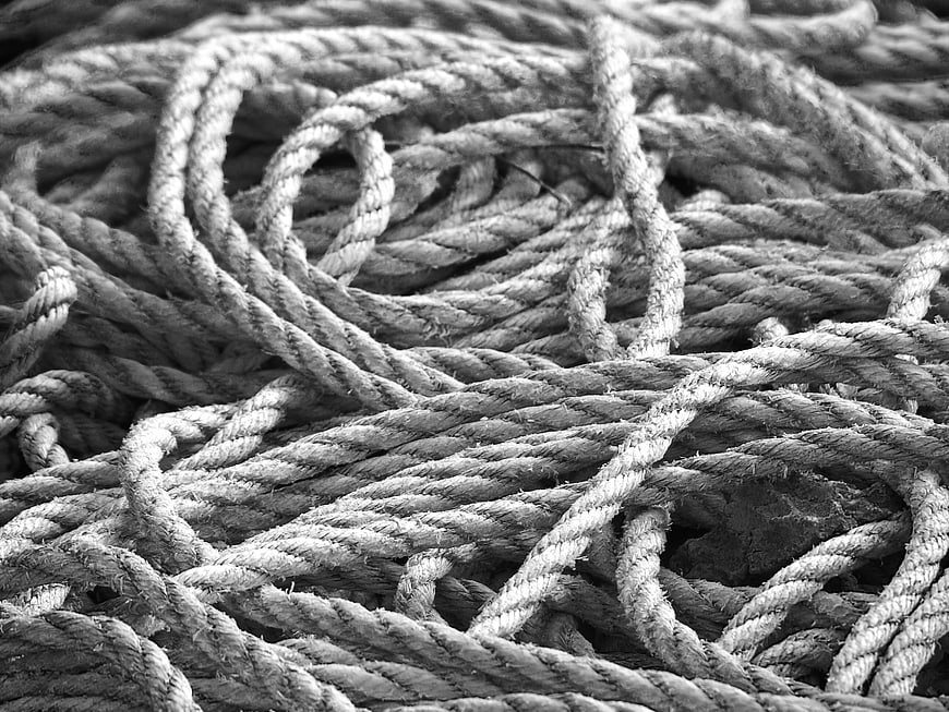 Close-up texture of tangled black and white rope
