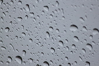 Close-up of raindrops on a glass window pane