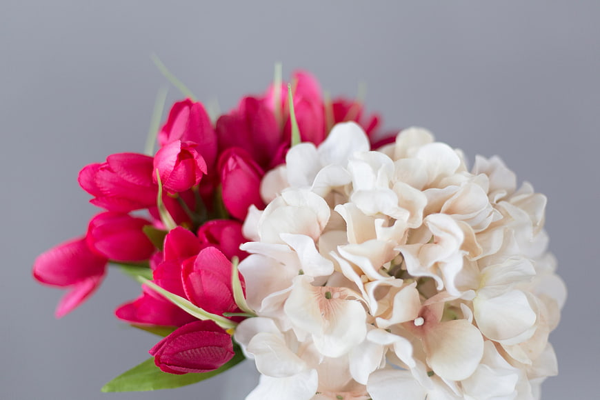 Close up of pink tulips and white hydrangeas bouquet