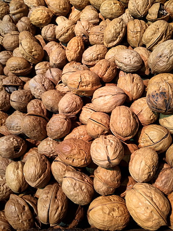 Close-up texture of whole walnuts in shell