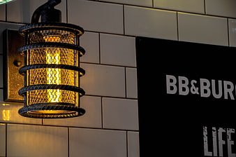 Industrial style wall lamp with Edison bulb and black sign