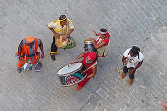 Aerial view of street musicians playing drums and trumpet