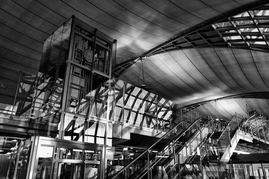 Black and White Airport Interior Architecture with Glass Elevator