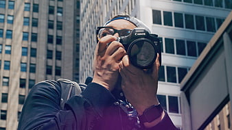 Urban Photographer Taking Photo with DSLR Camera