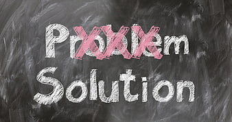 Problem crossed out with chalk on blackboard above solution