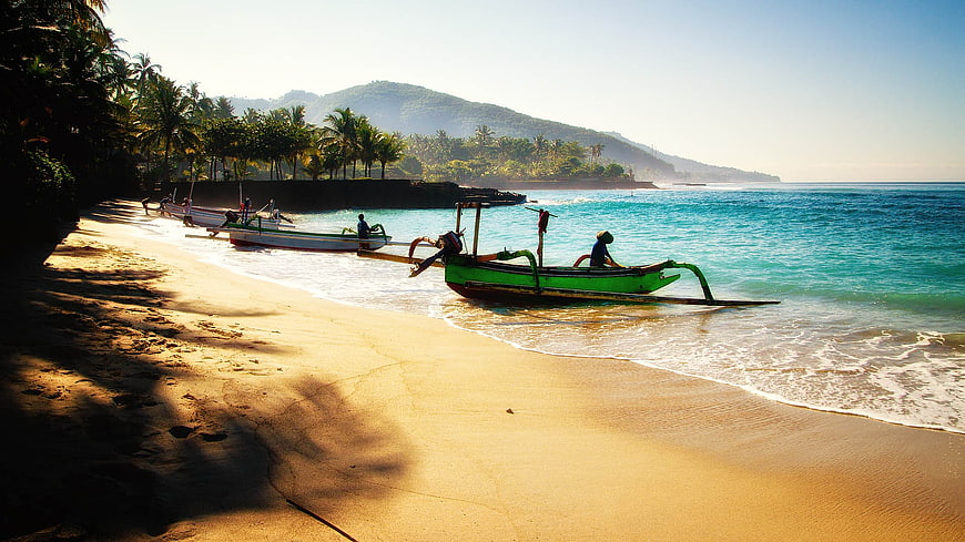 Traditional Balinese fishing boats on tropical beach