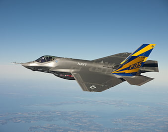 F-35 Lightning II Navy Fighter Jet Flying in Blue Sky