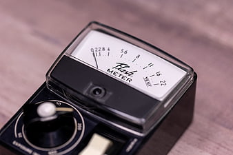 Vintage Flash Meter Close-Up on Wooden Surface
