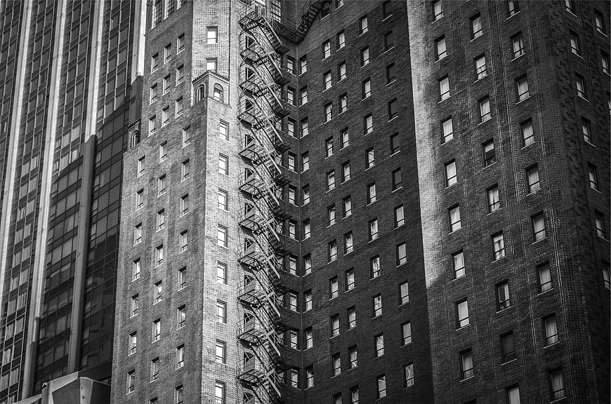 Black and white urban architecture with fire escape
