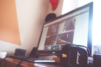 Marshall Headphones on Desk with Computer Monitor