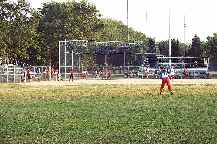 Softball game in progress on a sunny day