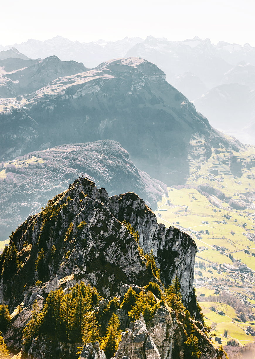 Dramatic Alpine Mountain Peak with Hikers and Valley View