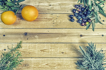 Mediterranean Food Flat Lay With Oranges, Olives, And Herbs On Wood