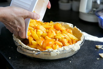 Pouring Peach Filling into Pie Crust