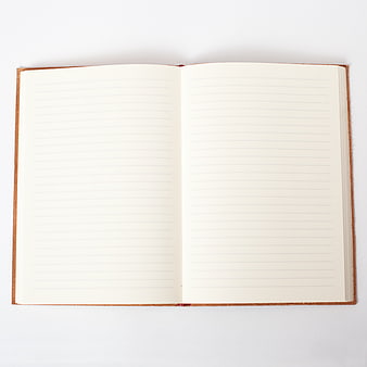 Open blank lined notebook on white background