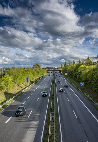 Highway Traffic Flow Under Dramatic Cloudy Sky