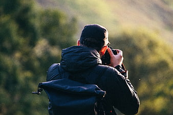 Photographer Taking Photo in Nature with DSLR Camera