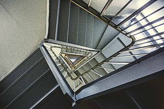Abstract view of modern triangular spiral staircase