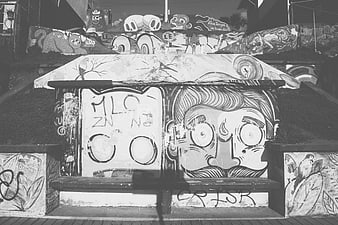 Black and white graffiti art on skate park bench