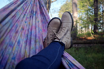 Relaxing in a colorful hammock in the forest