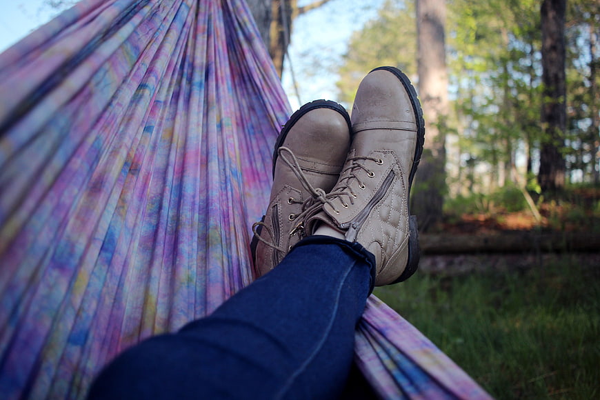 Relaxing in a colorful hammock in the forest