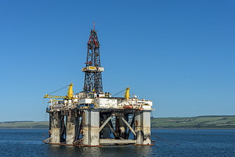 Offshore Oil Drilling Rig Platform In Calm Blue Waters
