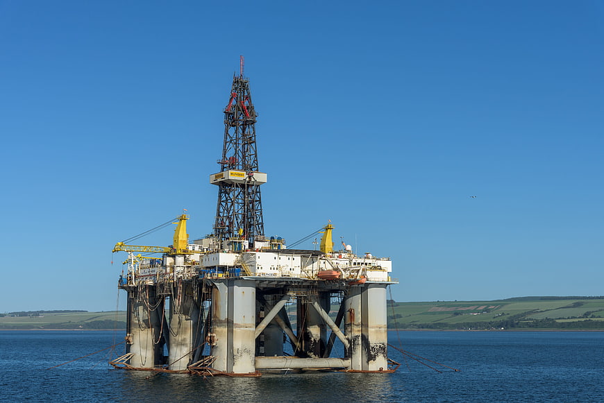 Offshore Oil Drilling Rig Platform In Calm Blue Waters