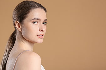 Portrait of a beautiful woman with natural makeup and ponytail