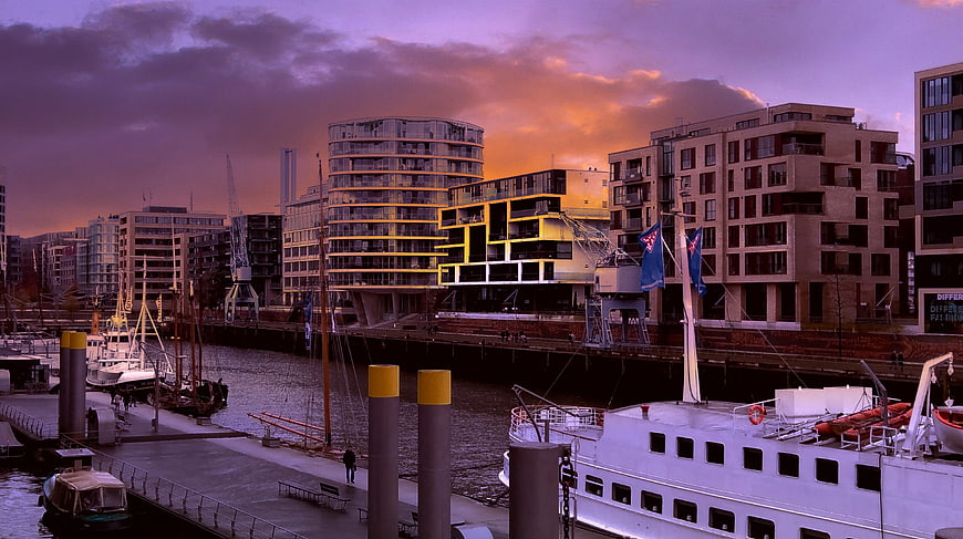 Modern City Marina at Sunset with Boats and Buildings