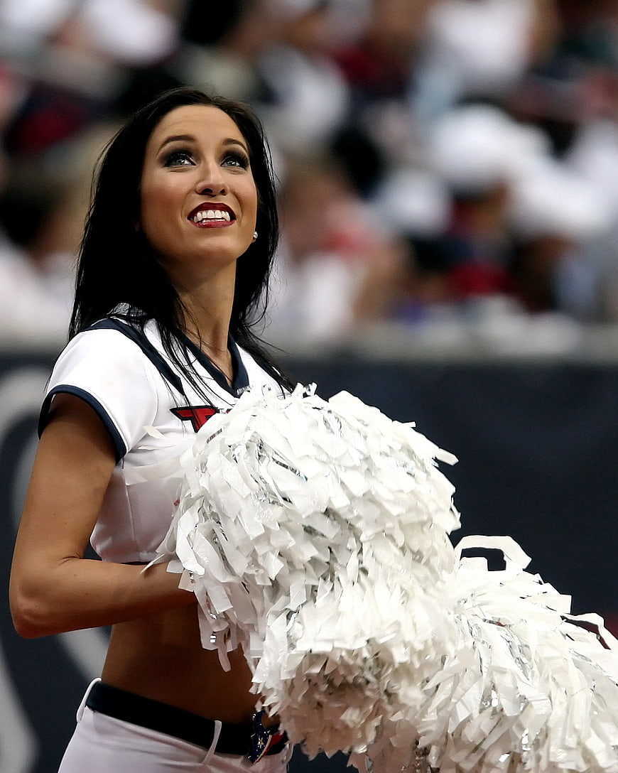 Cheerleader with White Pom-Poms Looking Up
