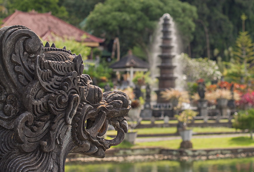 Bali Water Palace Dragon Statue With Blurred Fountain Background