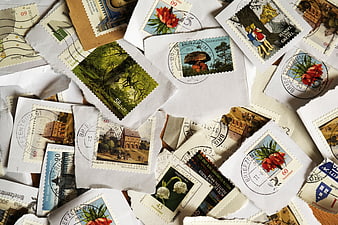 Vintage German Postage Stamps And Cancelled Postmarks On White Paper