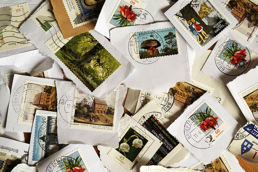 Vintage German Postage Stamps And Cancelled Postmarks On White Paper