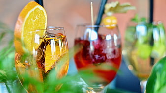 Refreshing Summer Cocktails with Orange and Fruit Garnish