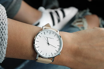 Minimalist Beige Strap Watch on Wrist with Sneakers